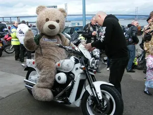 Baxterbear Rides Off on Poppy Bike